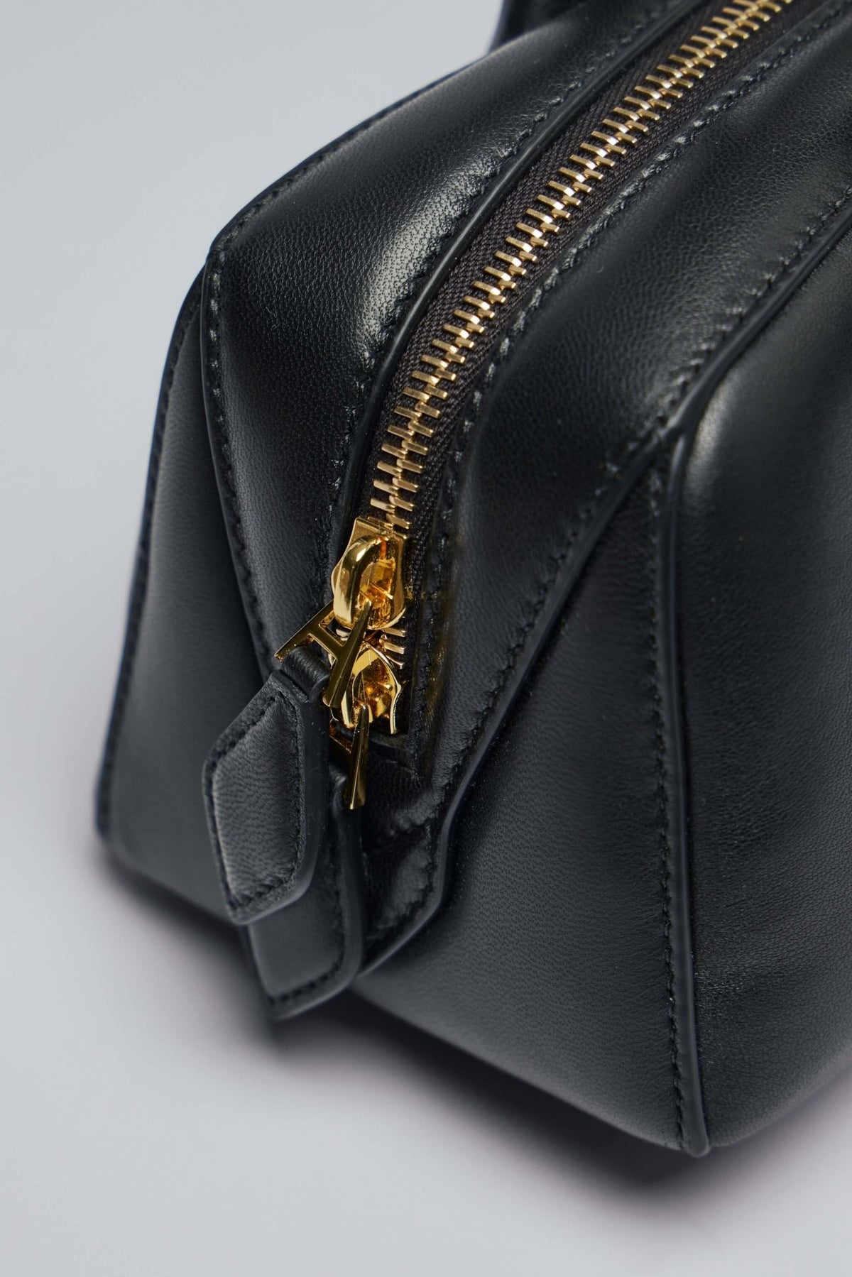 Interior view of Alaïa Le Teckel bag showing spacious compartment