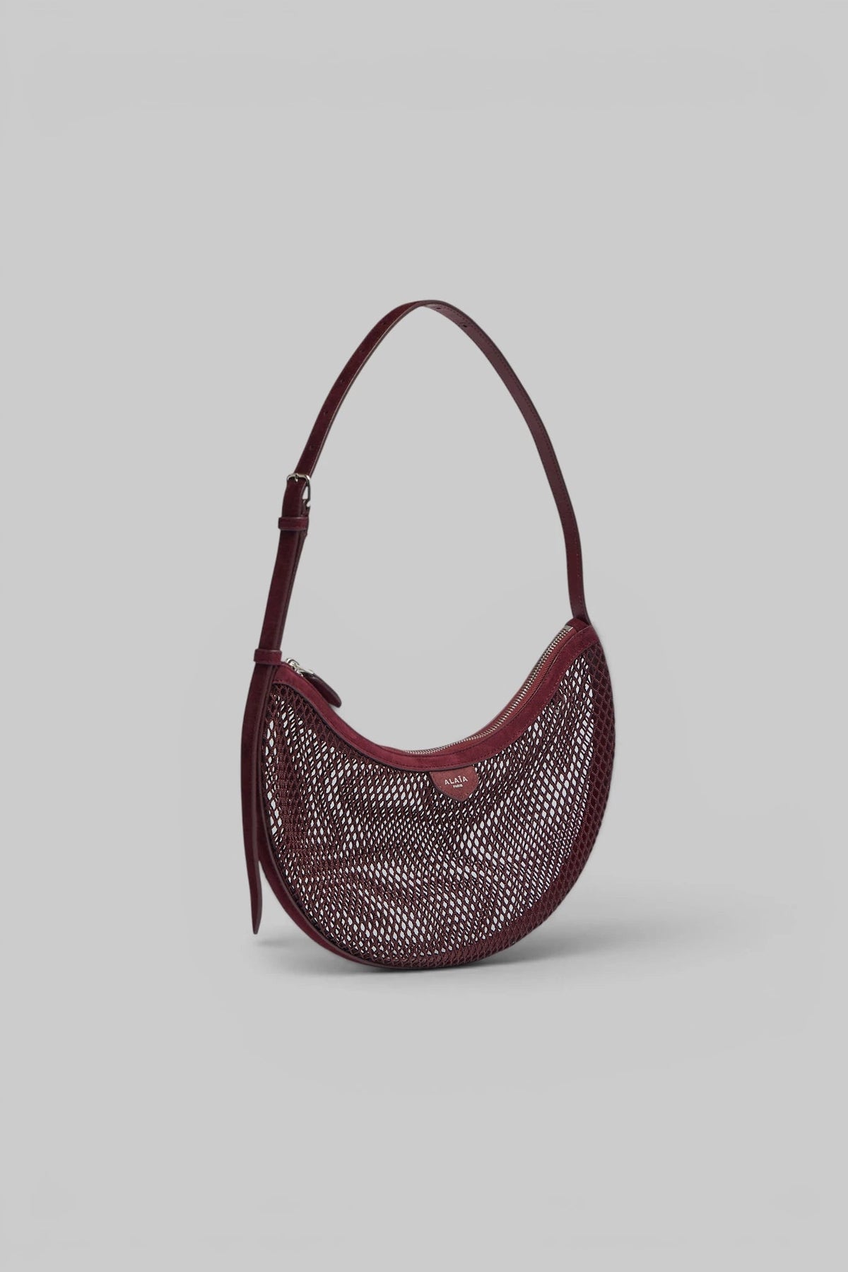 Alaïa Demi Lune clutch styled with evening wear