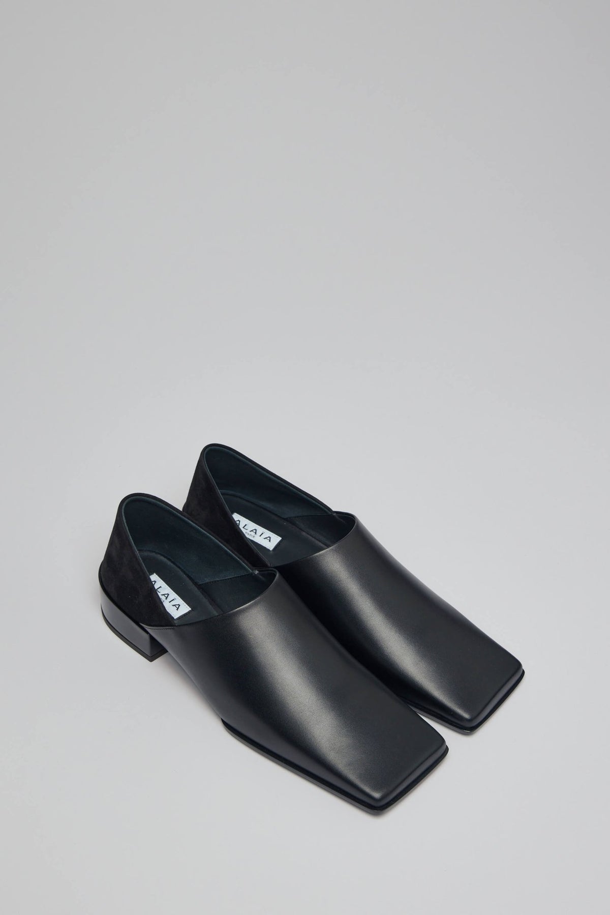 Side view of Alaïa Slippers 20 showing sleek profile