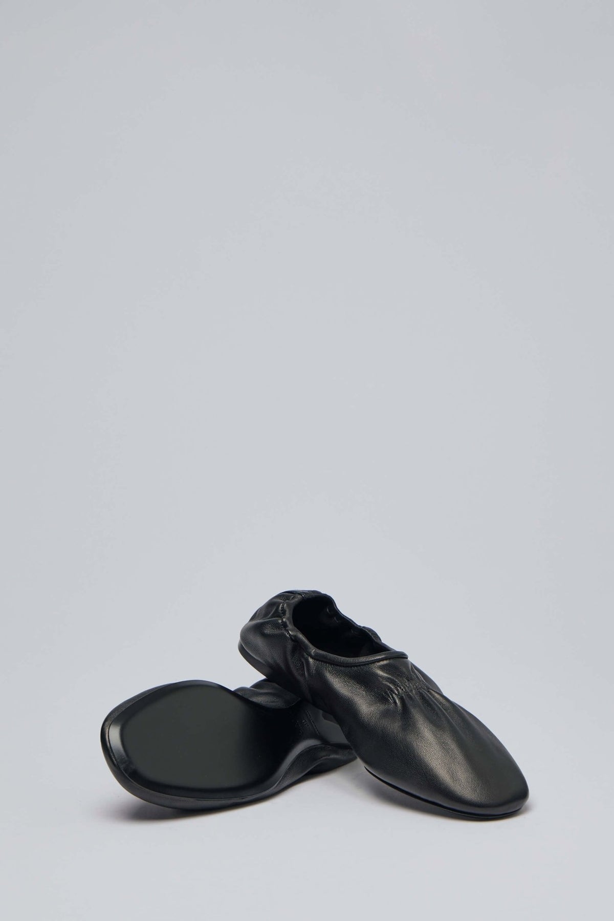 Alaïa leather slippers styled for elegant everyday wear