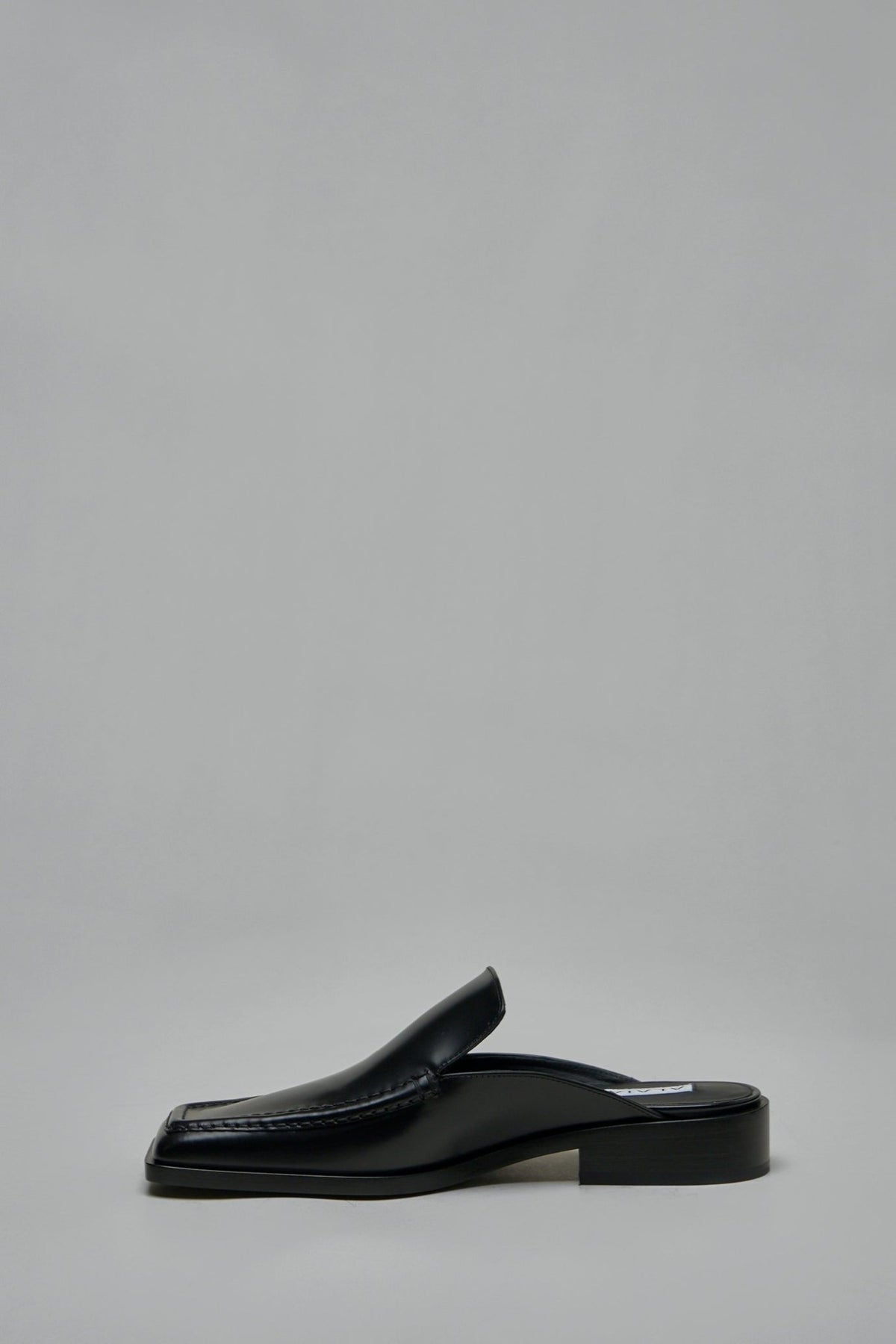 Detail shot of square toe design on Alaïa leather mules
