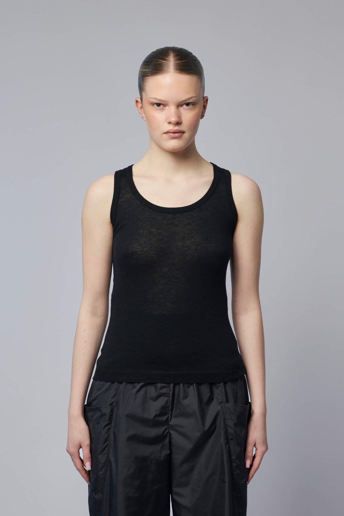 Close-up of ribbed neckline detail on Alaïa tank top