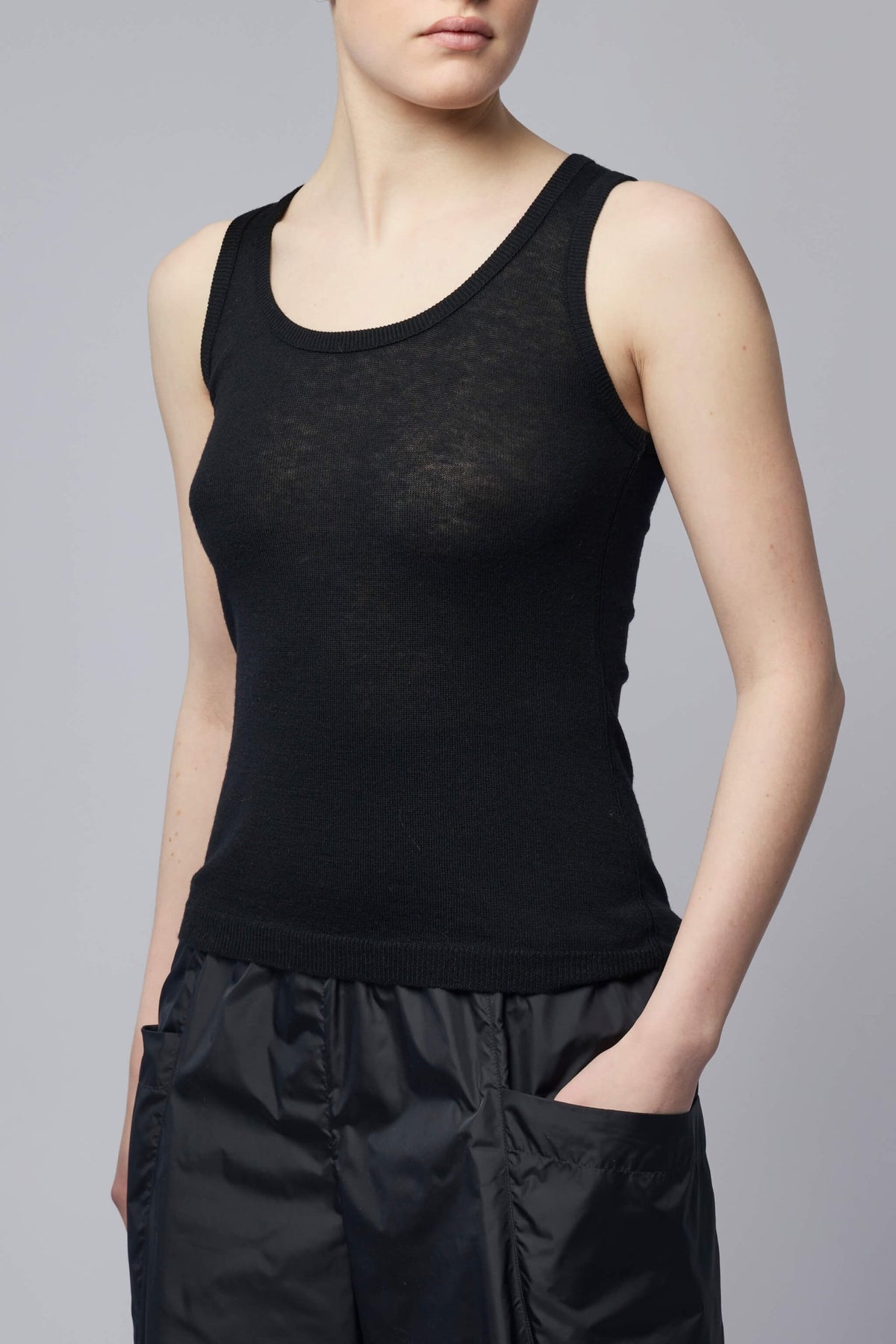 Model wearing fitted Alaïa tank top showing silhouette