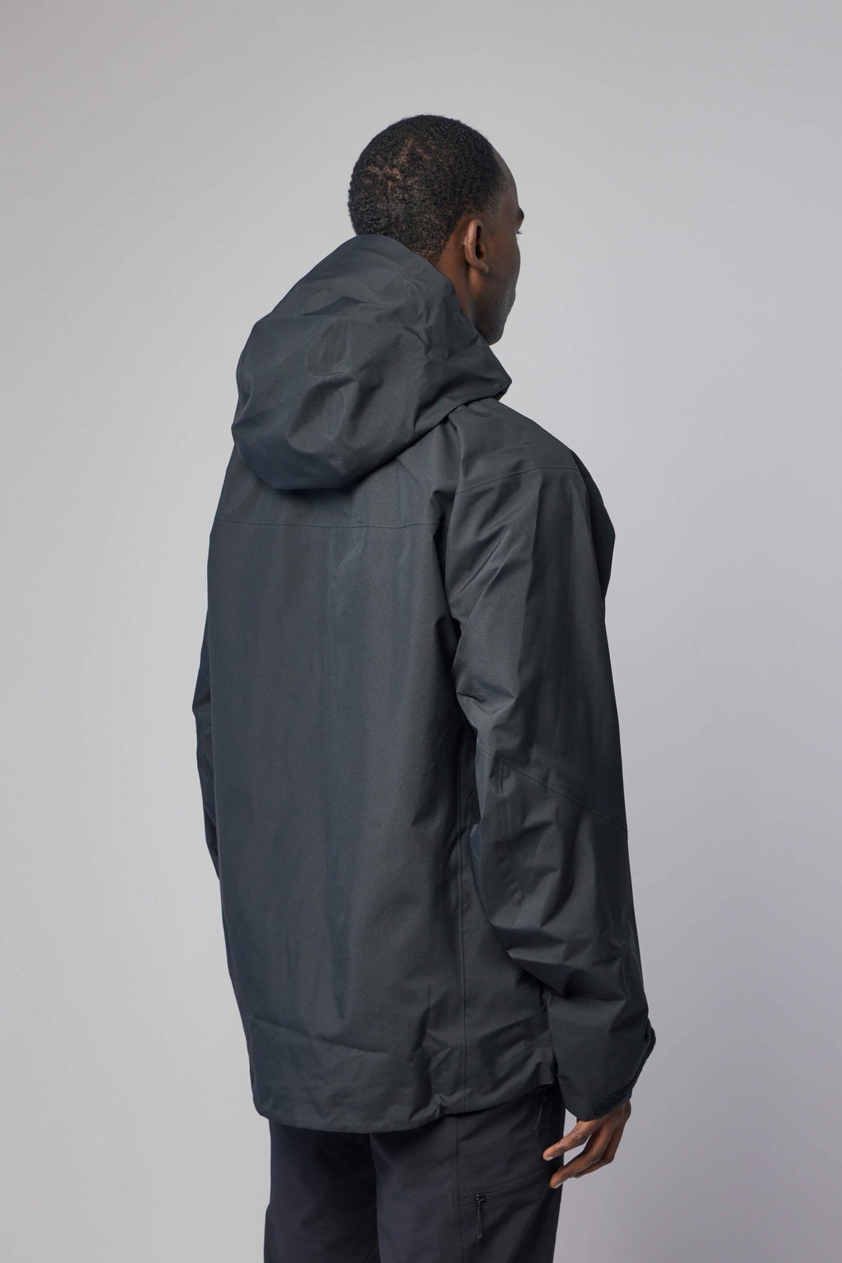 Back view of ARC'TERYX technical jacket with adjustable hood features, view 5