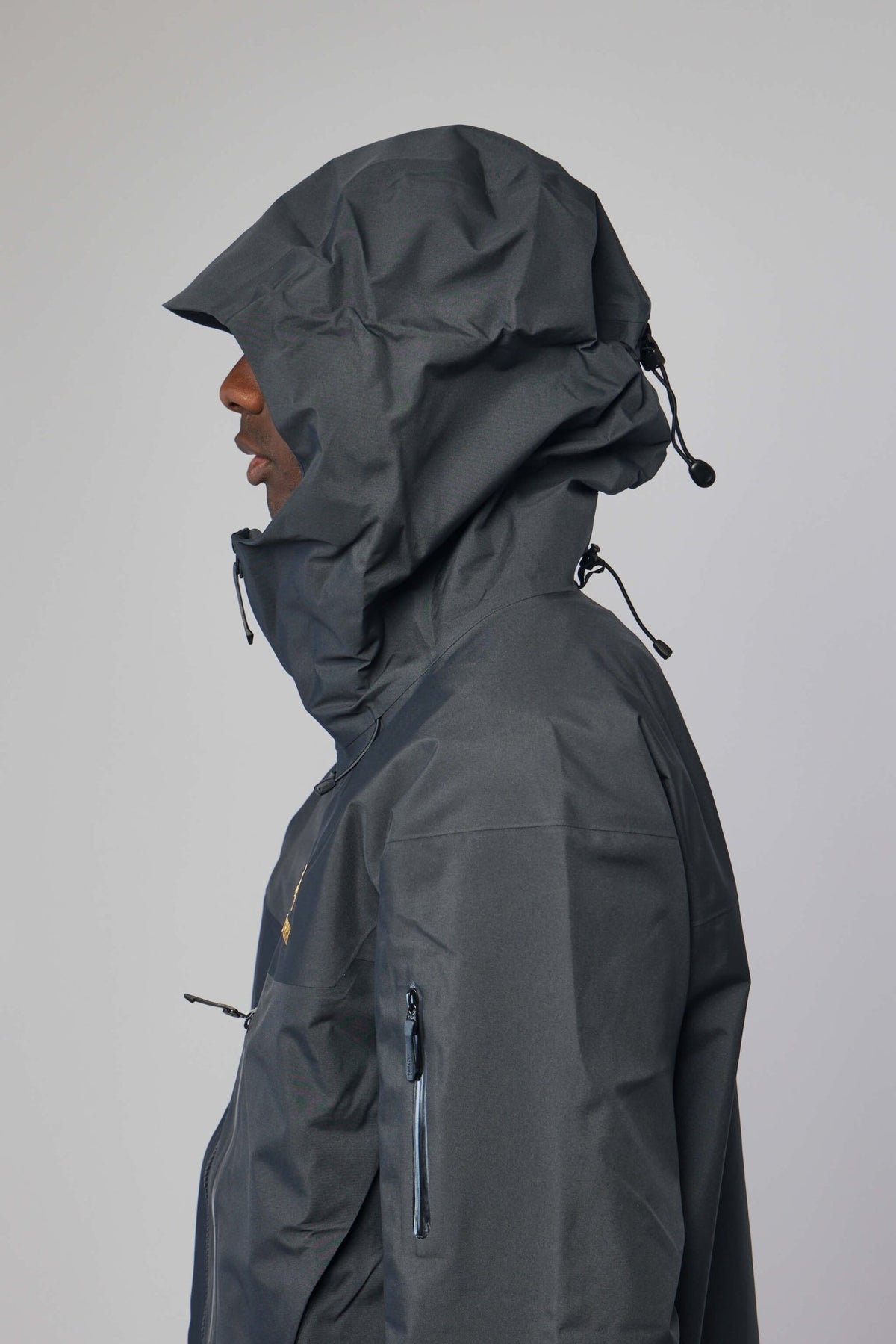 Back view of ARC'TERYX technical jacket with adjustable hood features, view 6
