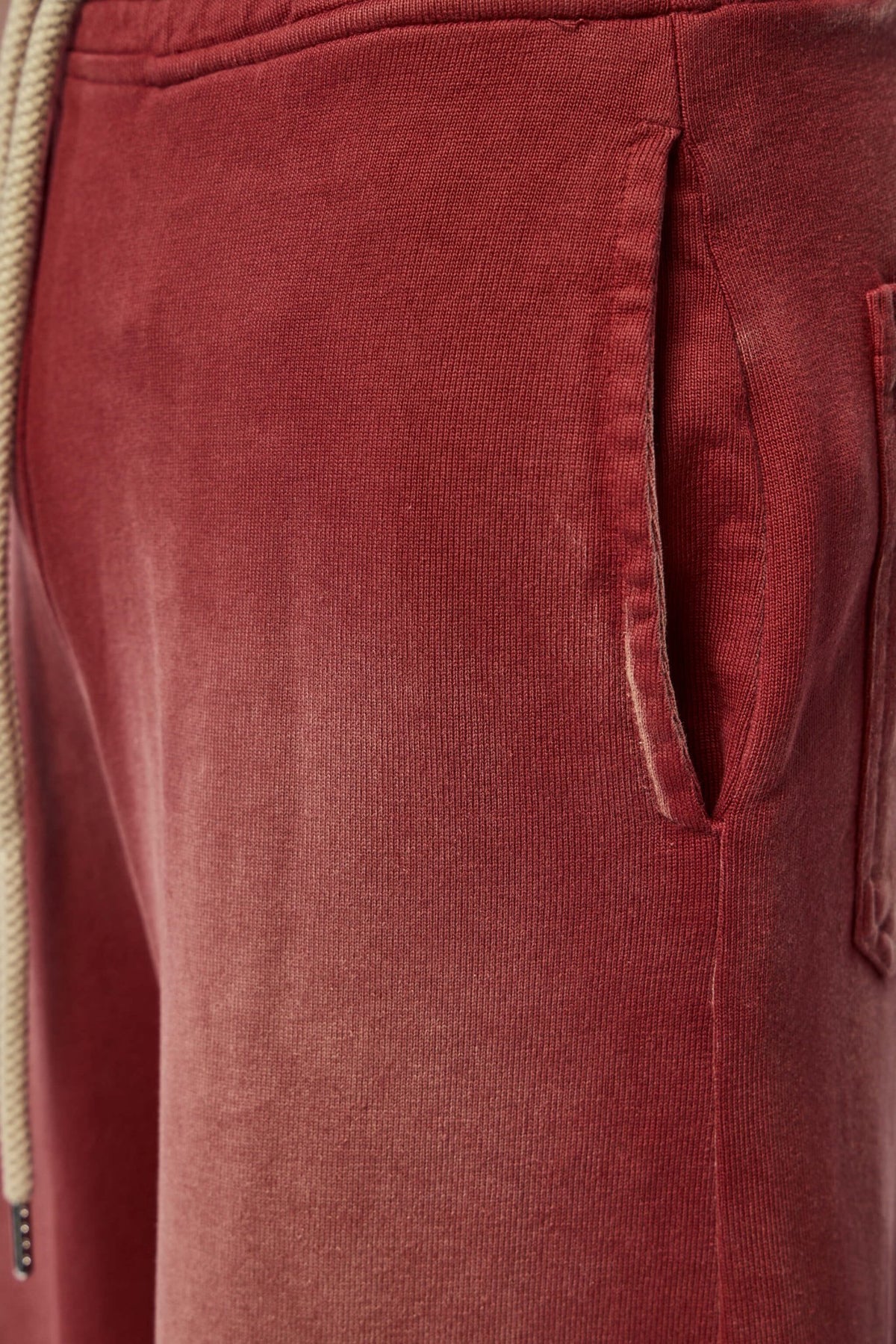 Full-length view of oversized red cargo pants styling