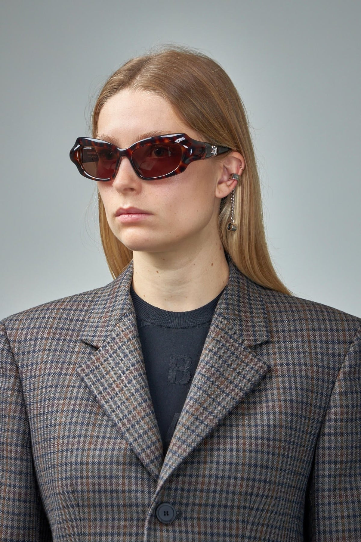 Close-up of Balenciaga Palazzo sunglasses showing gold temple detailing