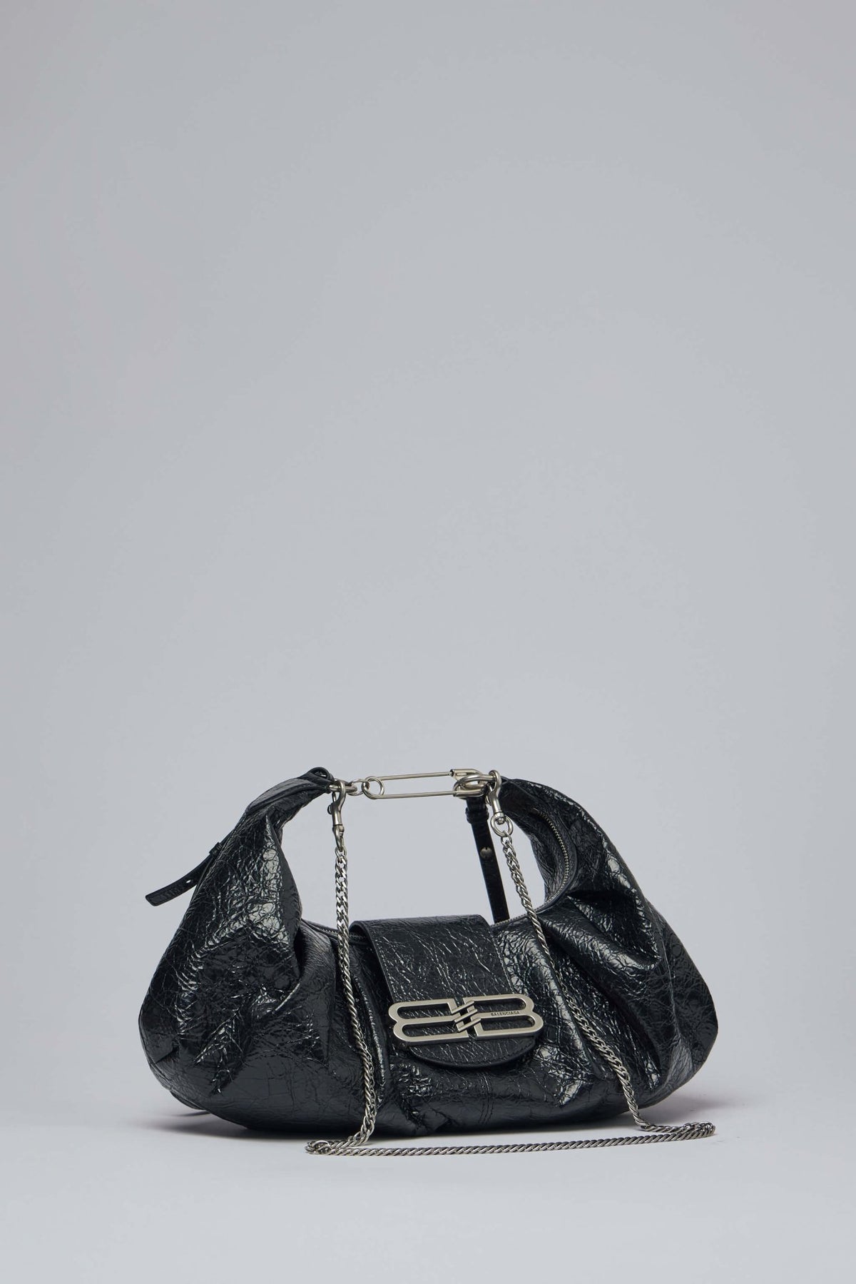 Close-up view of Balenciaga Pamela bag front flap with signature logo detail