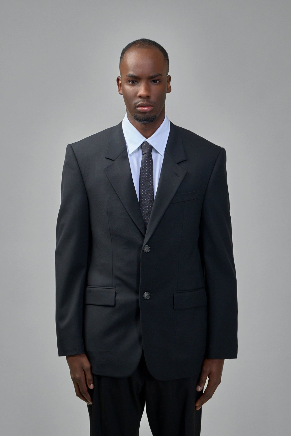 Close-up of Balenciaga blazer showing premium wool texture and button details