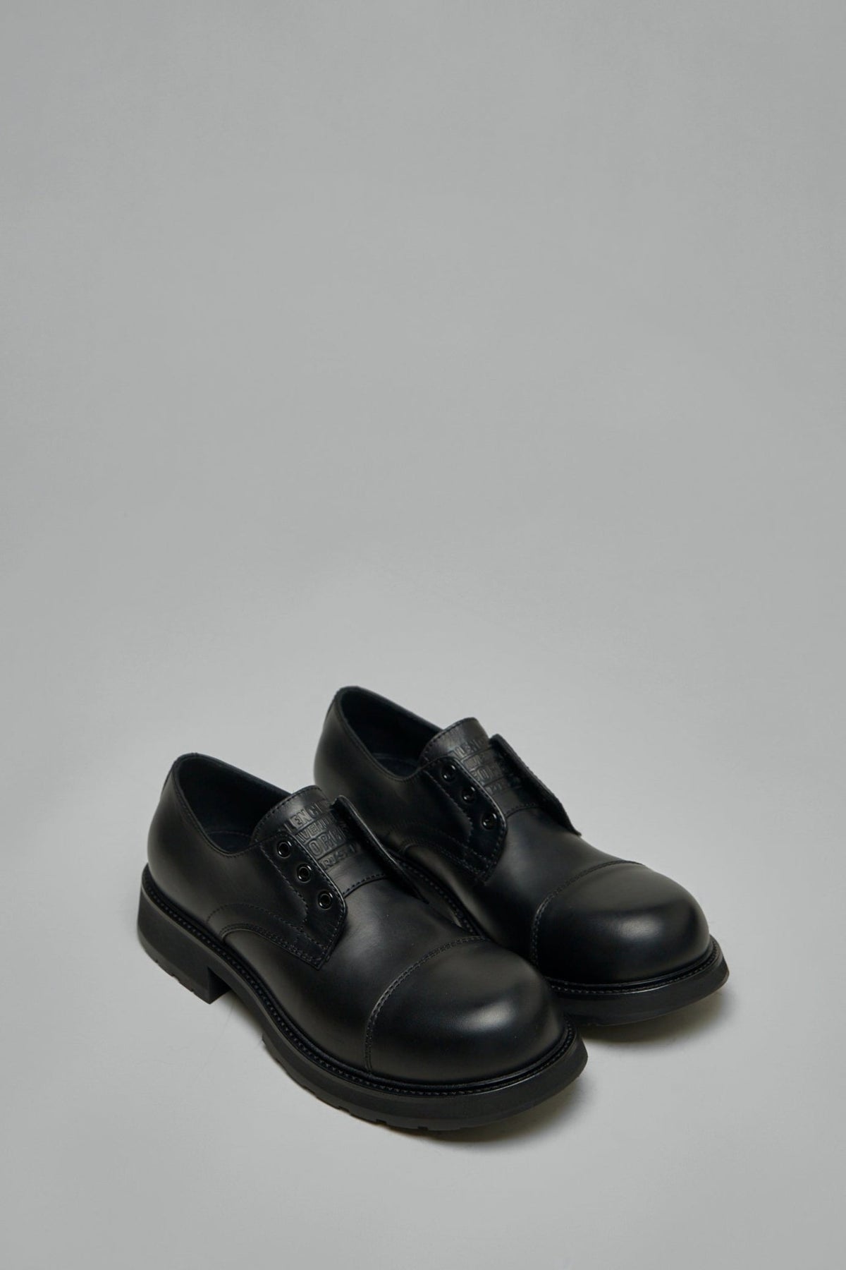 Close-up of Balenciaga Truck Derby flats showing detailed stitching