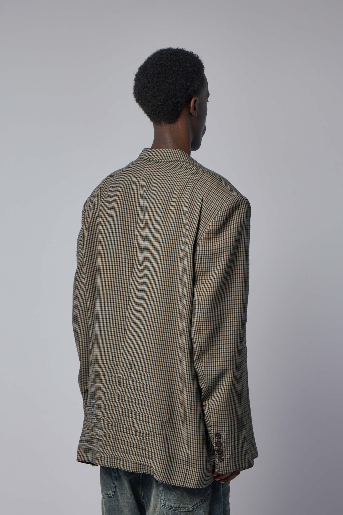 Back view of Balenciaga houndstooth blazer showing expert tailoring