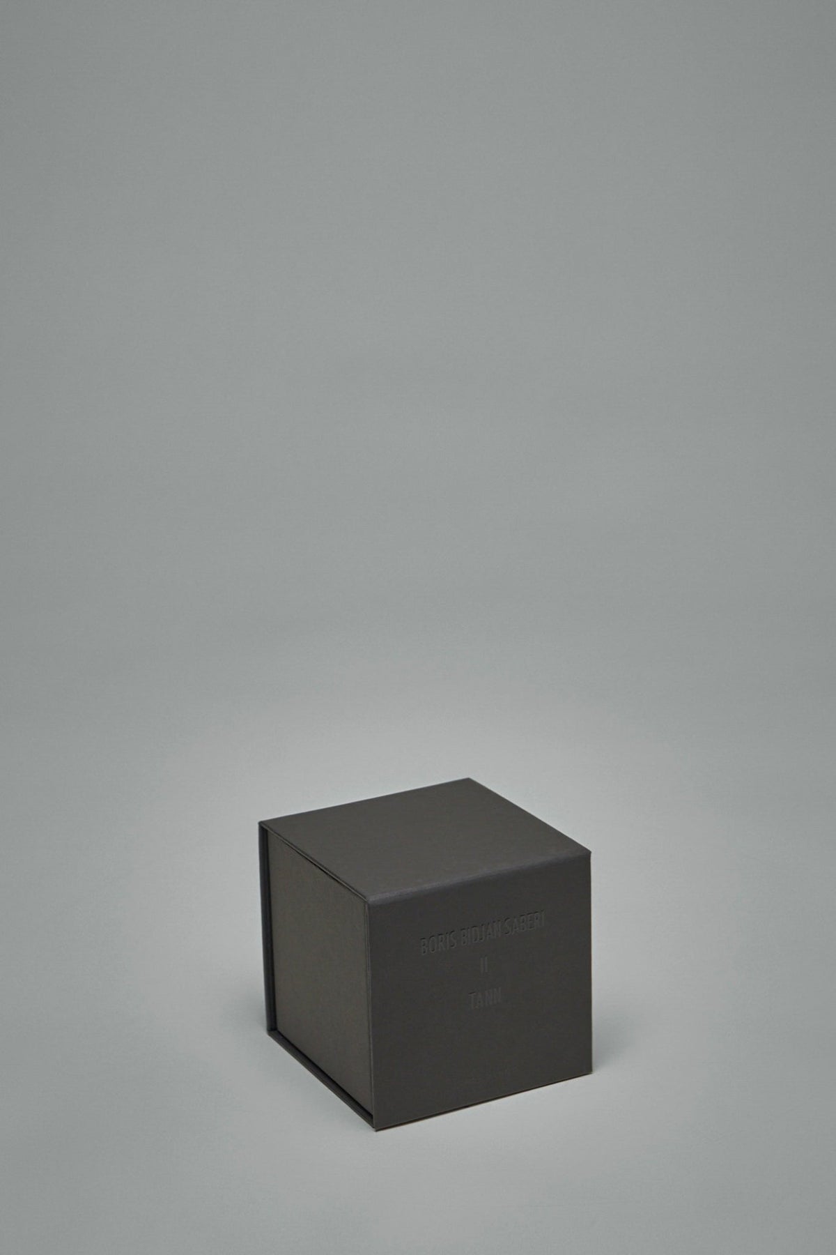 Boris Bidjan Saberi luxury candle TANN displayed in modern interior setting