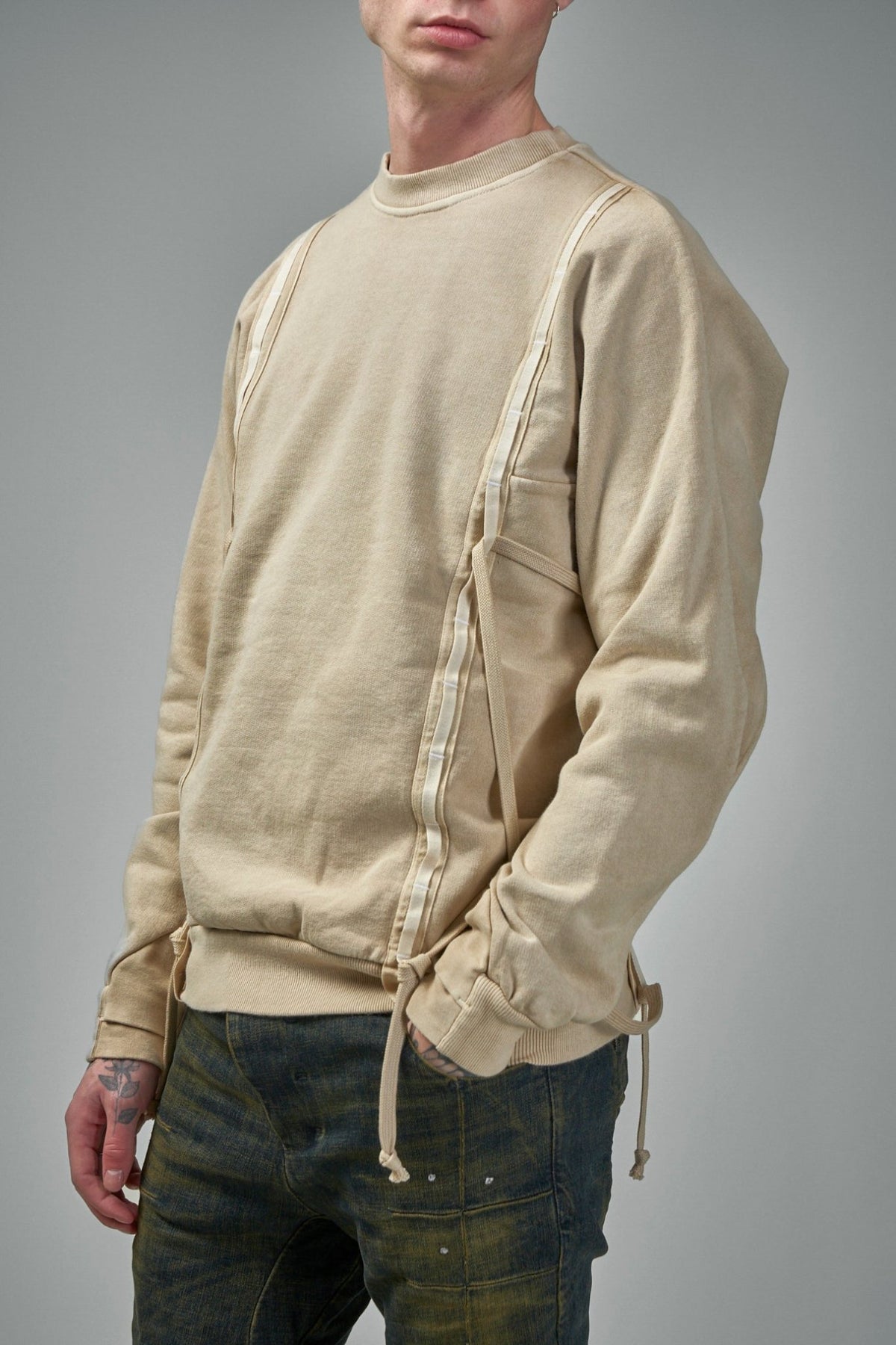 Drawstring detailing on avant-garde designer cotton knitwear