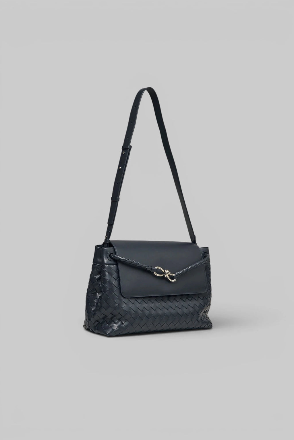 Bottega Veneta clutch with braided shoulder strap detail