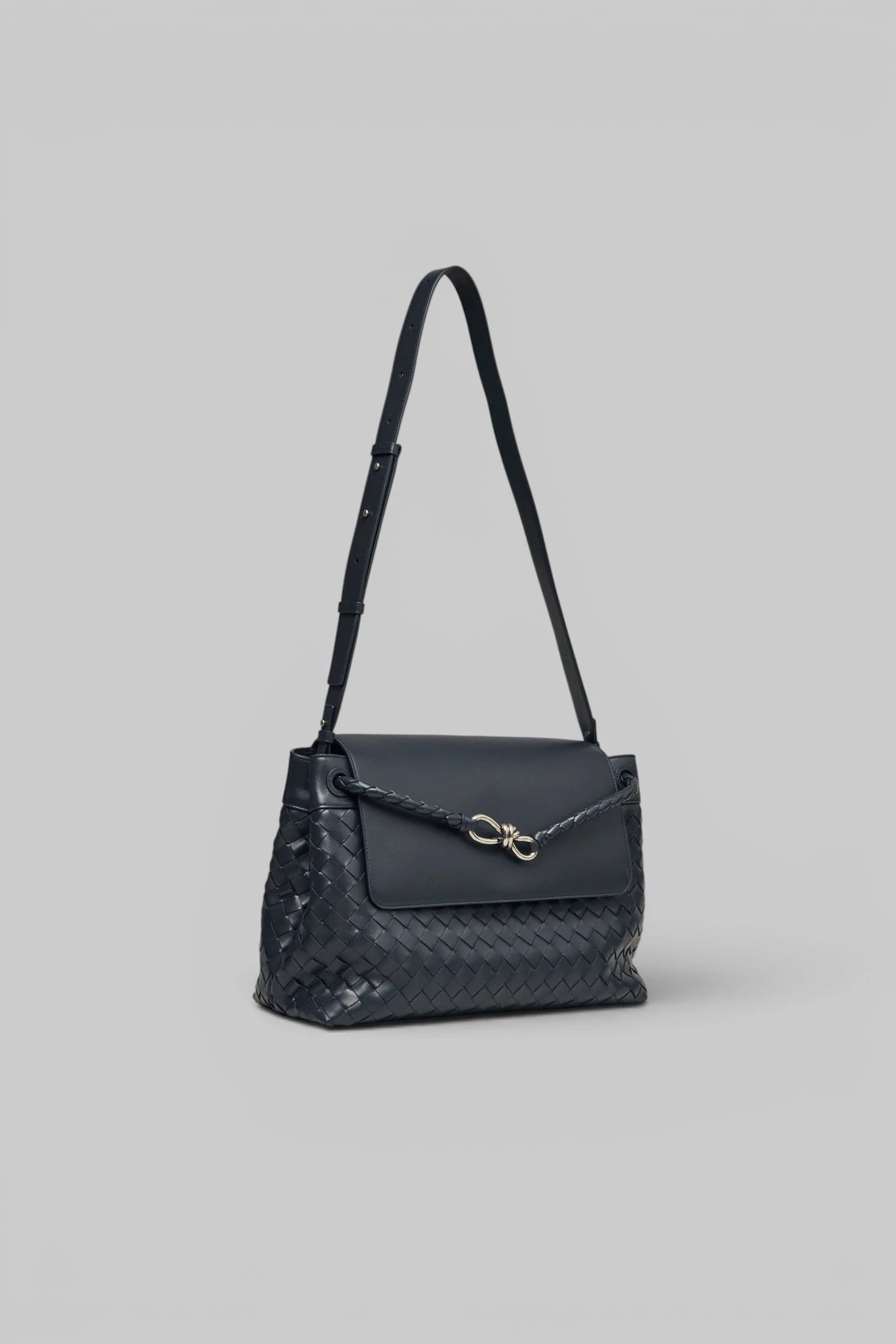 Bottega Veneta clutch with braided shoulder strap detail