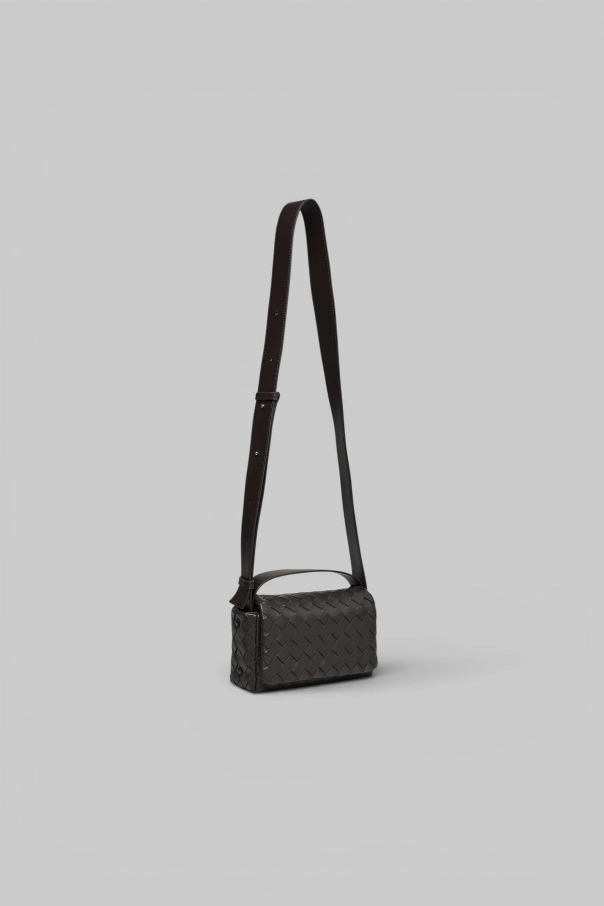 Close-up of intrecciato leather weave on Bottega Veneta crossbody bag