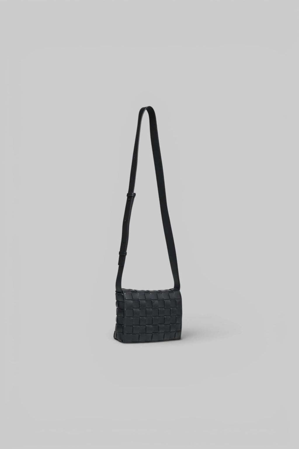 Close-up of woven Intrecciato leather pattern on Bottega Veneta crossbody bag