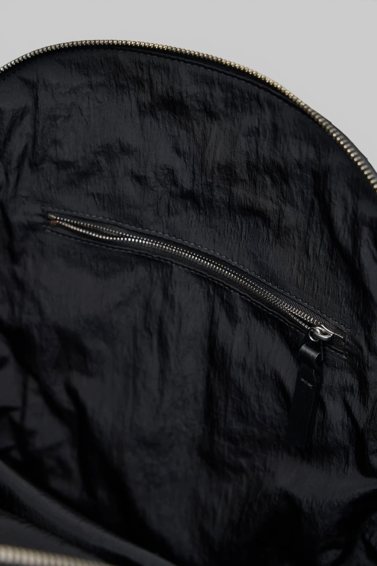 Bottega Veneta backpack styled with tailored outfit