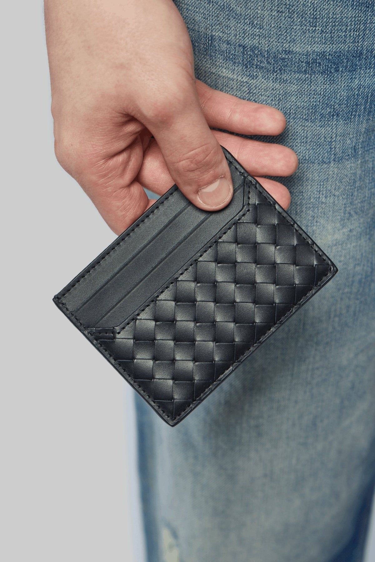 Close-up of Intrecciato weave texture on Bottega Veneta cardholder