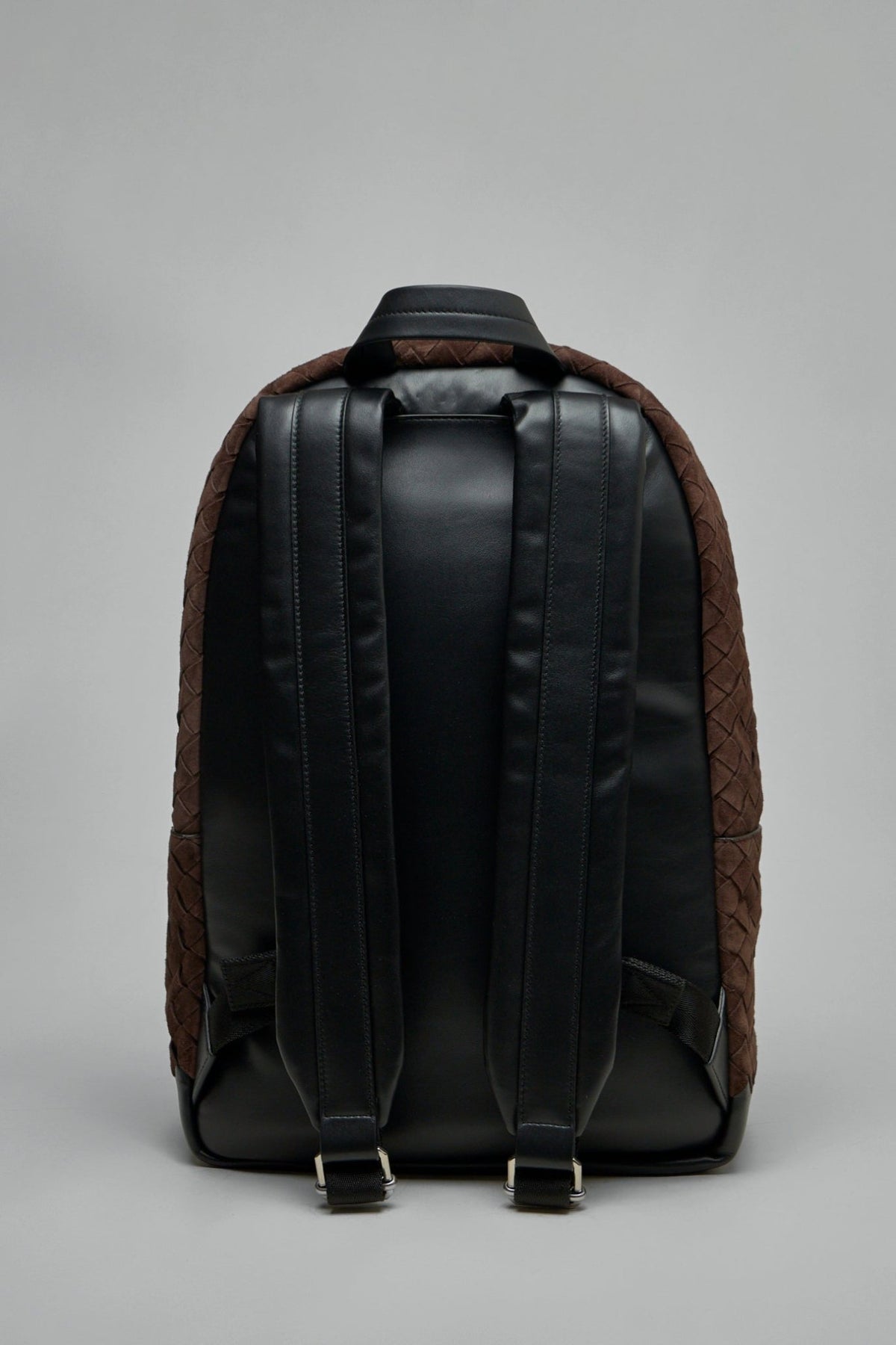 Adjustable black straps and front pocket detail on Bottega Veneta backpack