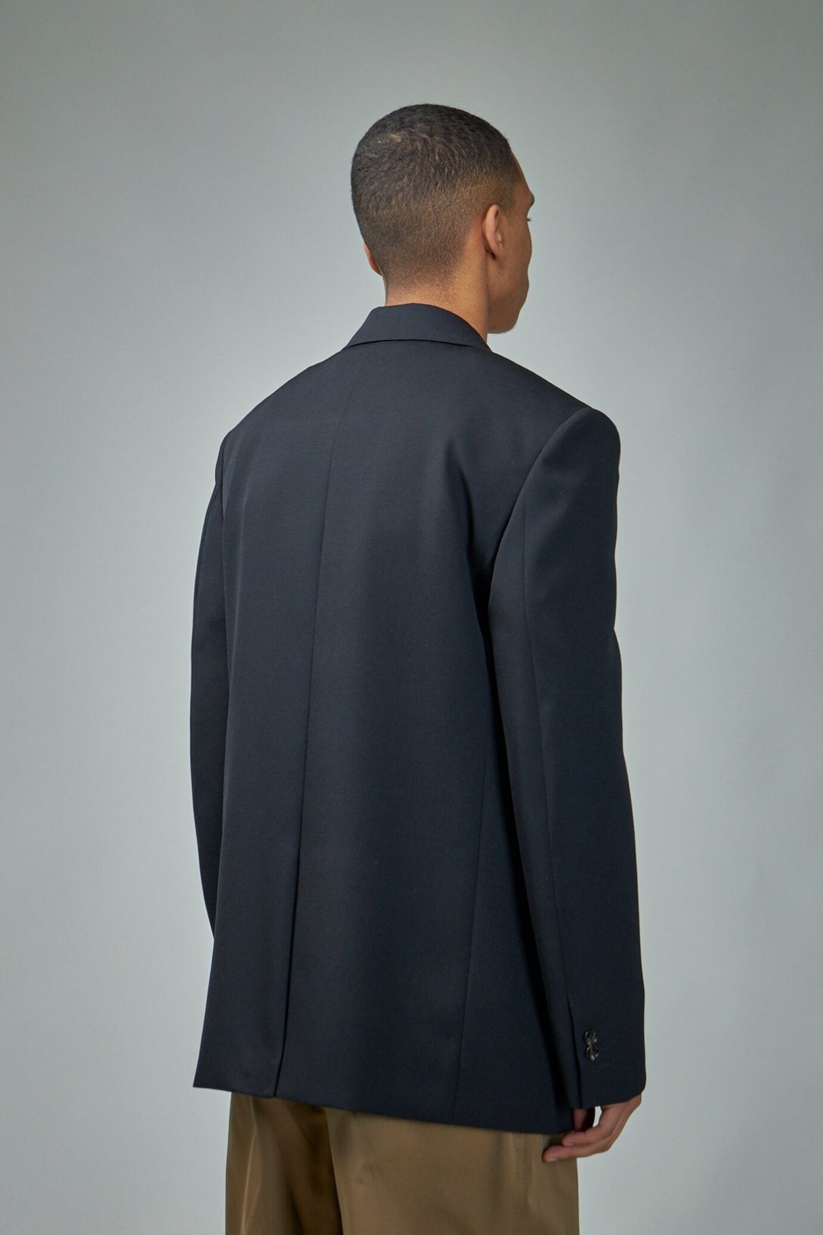 Side view showing structured silhouette and expert Italian tailoring