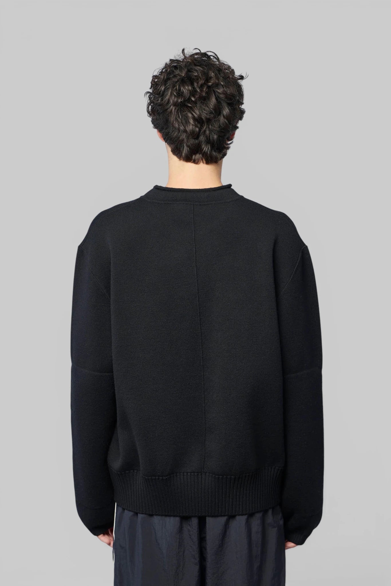 Bottega Veneta sweater styled with tailored trousers