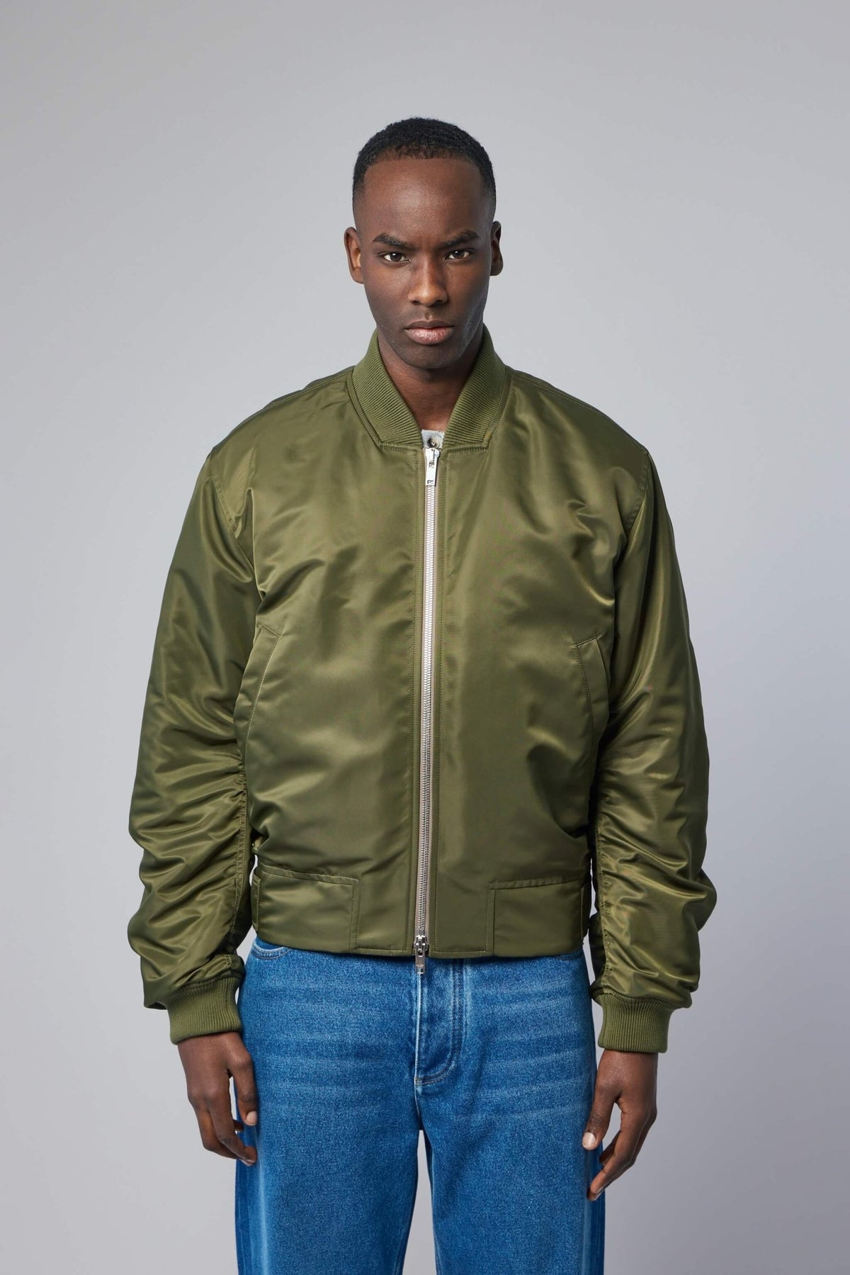Close-up detail of premium nylon bomber jacket construction