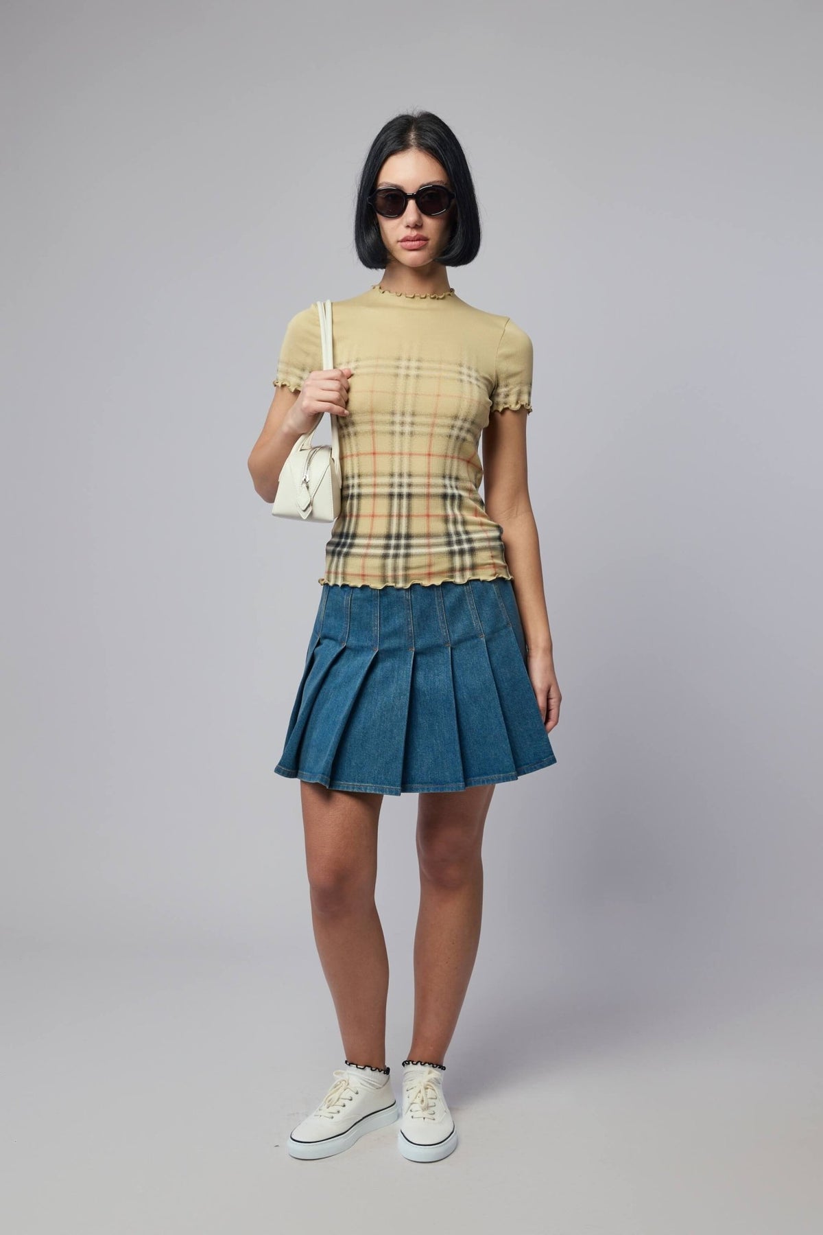 Back view of Burberry Dahlia mini skirt showing pleated silhouette