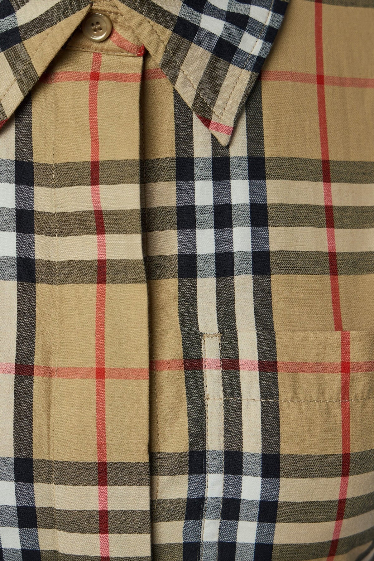 Full-length view of model wearing Burberry plaid midi dress with long sleeves