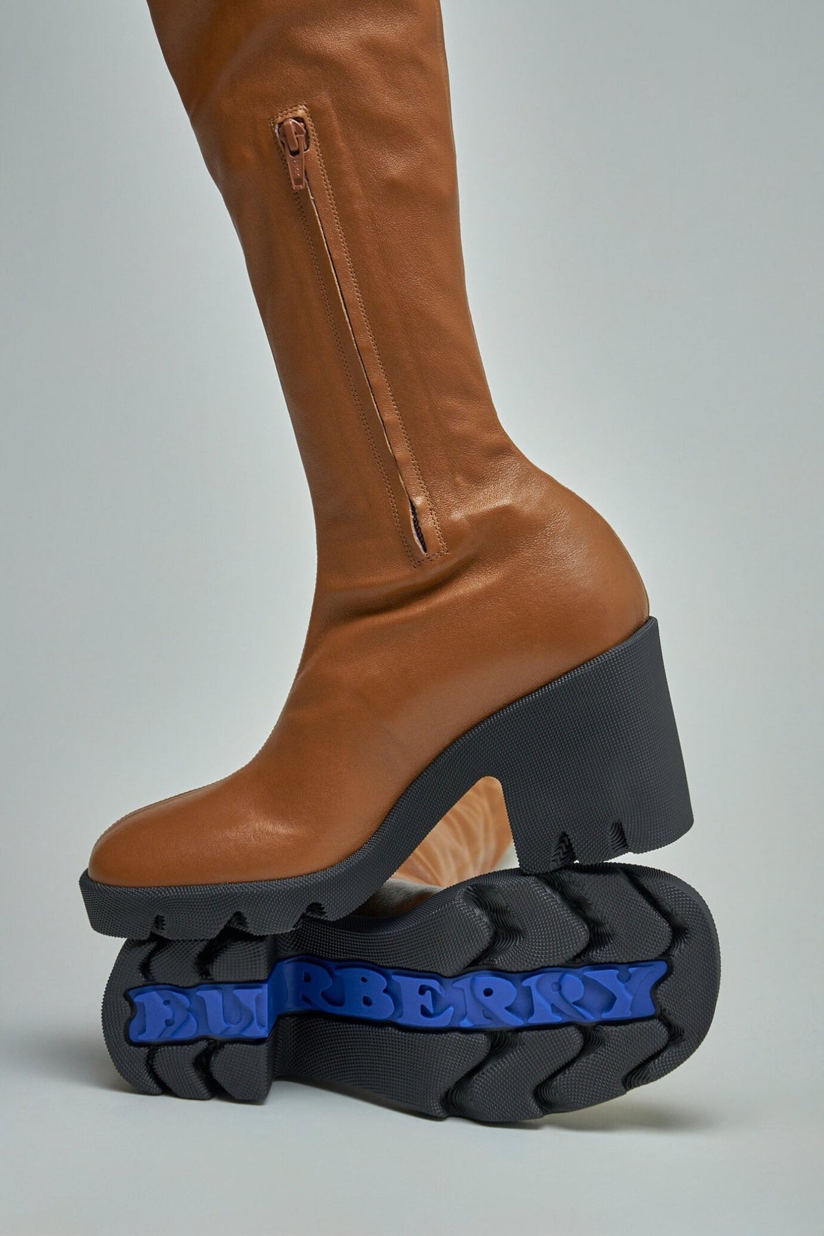 Full view of Burberry leather stride boots styled for luxury fashion