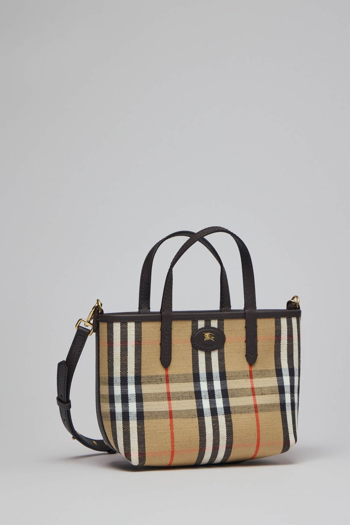 Close-up of Burberry tote bag showing textured cotton blend material and metallic logo