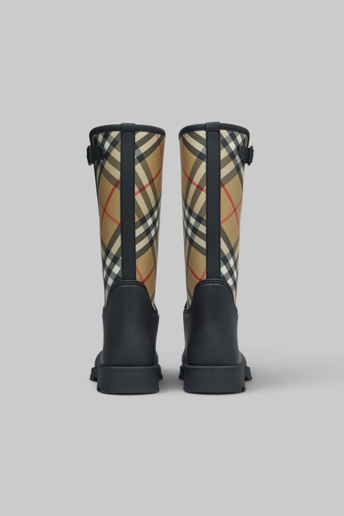 Detail shot of plaid pattern on Burberry rubber boots with black base