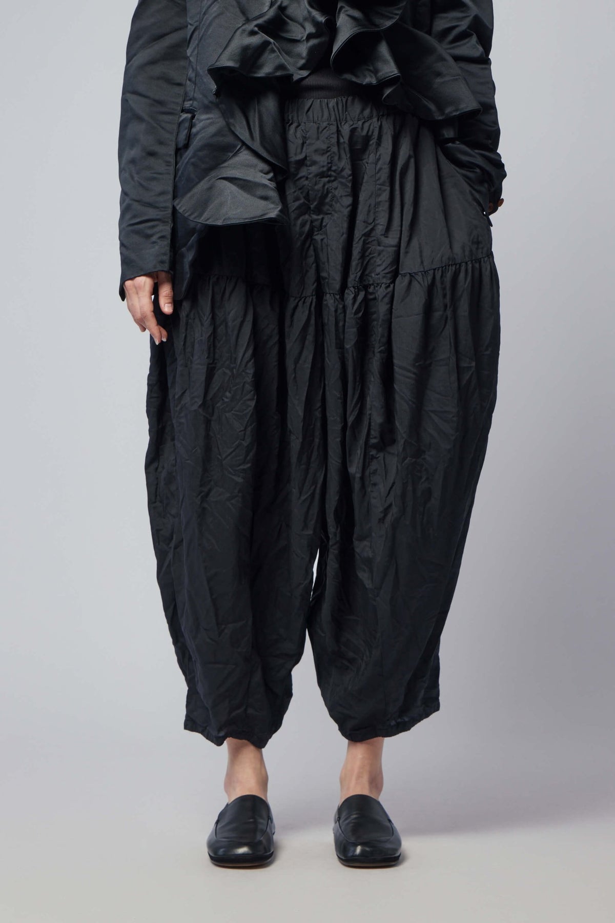 Comme des Garçons BLACK cargo pants in premium polyester with unisex design
