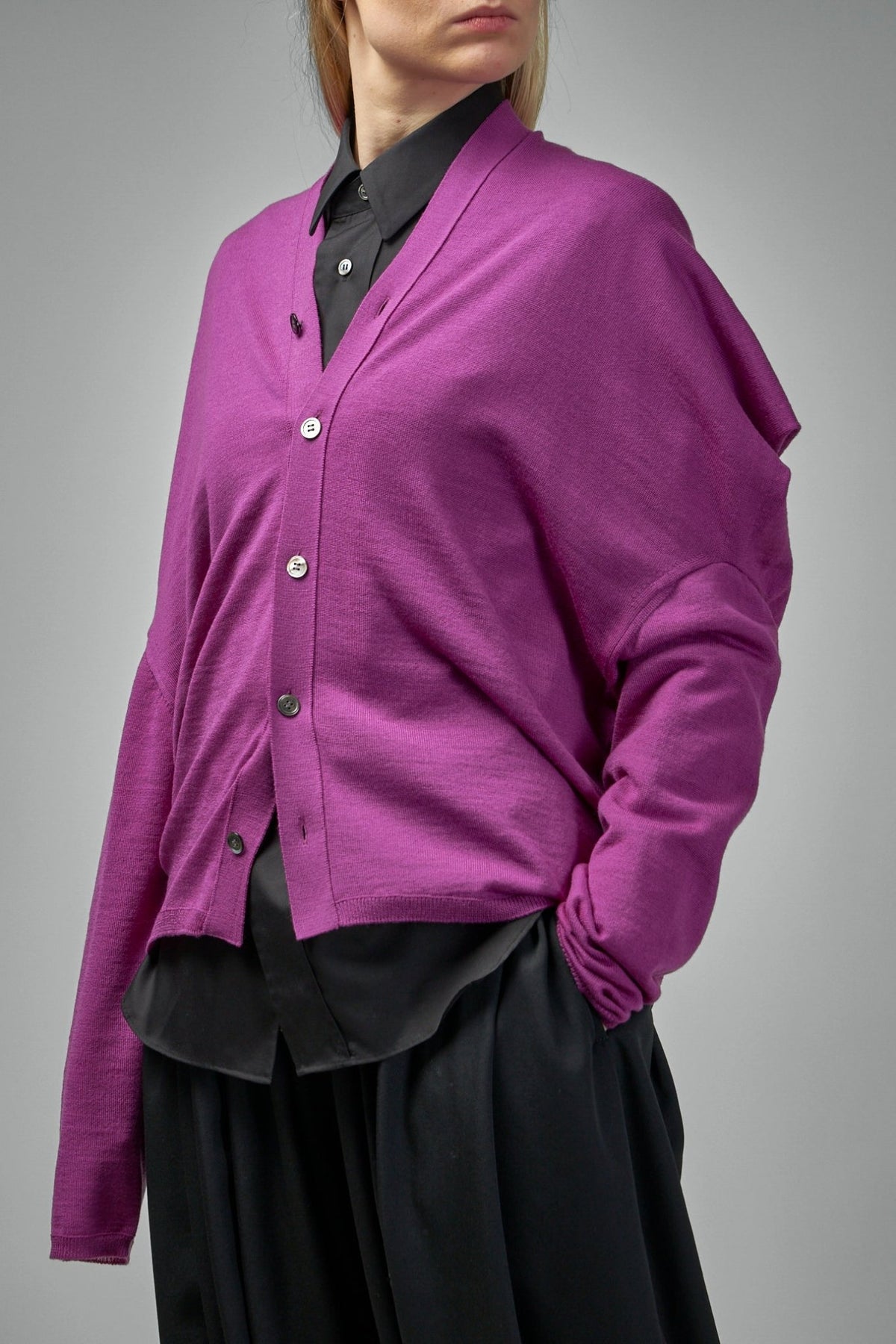 Full view of minimalist wool cardigan showing clean lines and silhouette