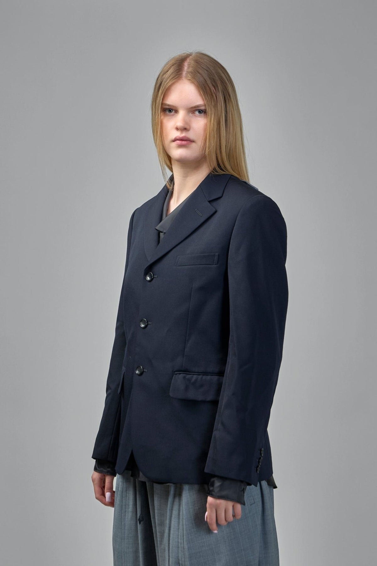 Full outfit styling with asymmetric blazer and complementary pieces