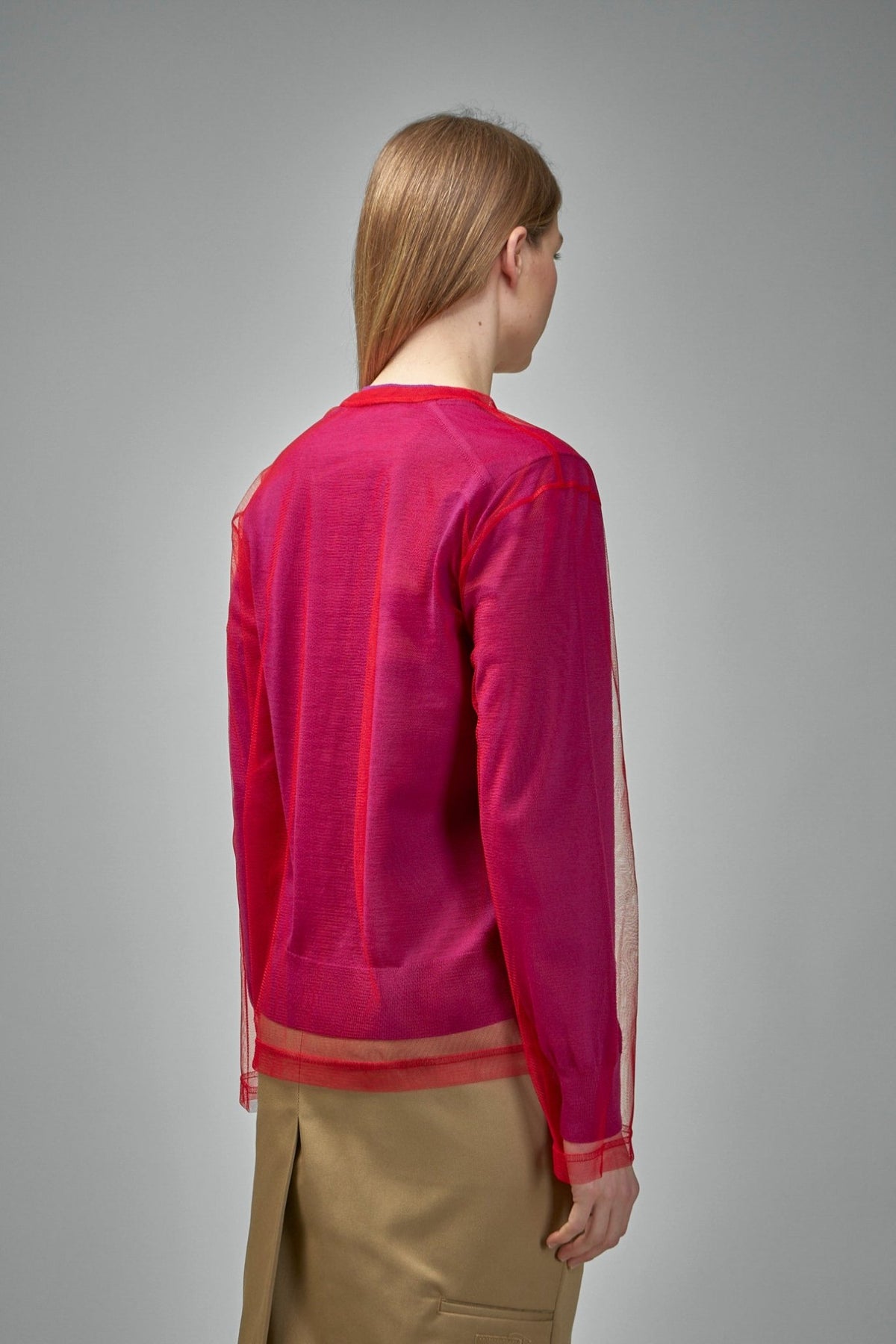 Model wearing Comme des Garçons layered cardigan styled for contemporary look