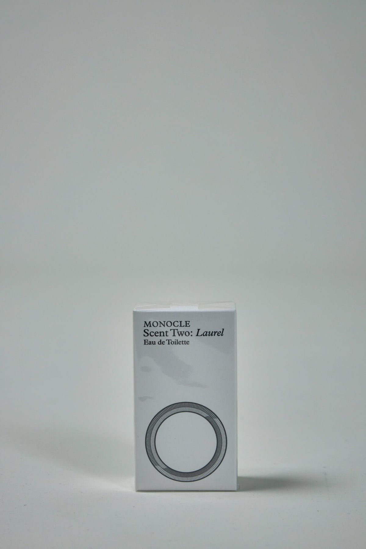 Monocle Scent Two Laurel fragrance bottle detail showing minimalist design and branding