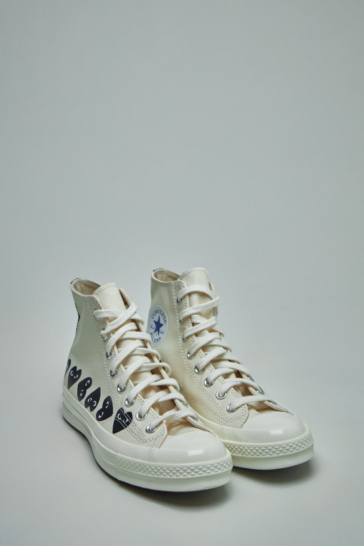 Side view of Multi Heart High Top Shoes showing fabric upper construction