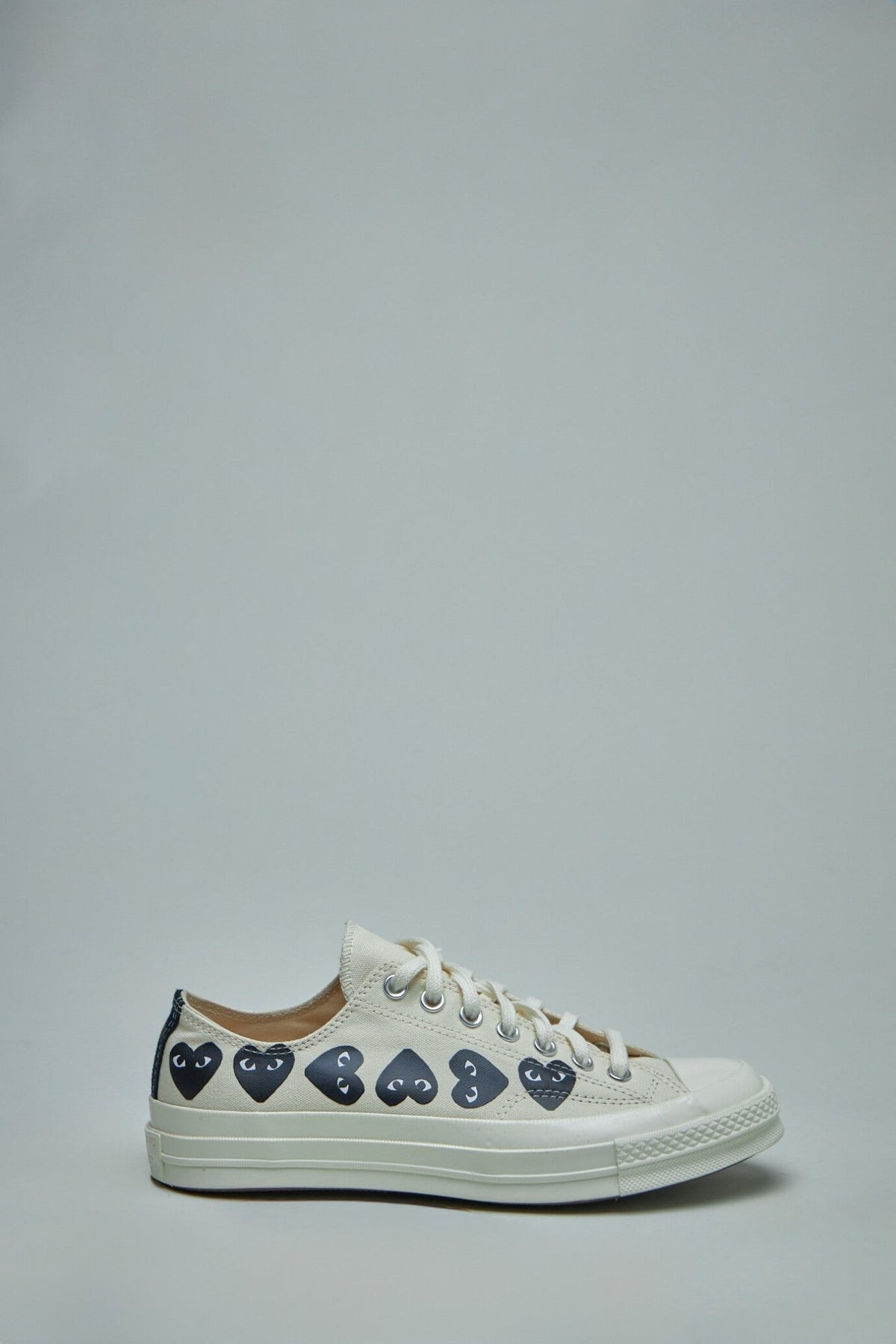 Comme des Garçons PLAY CONVERSE Low Top Sneakers with multi-heart logo design