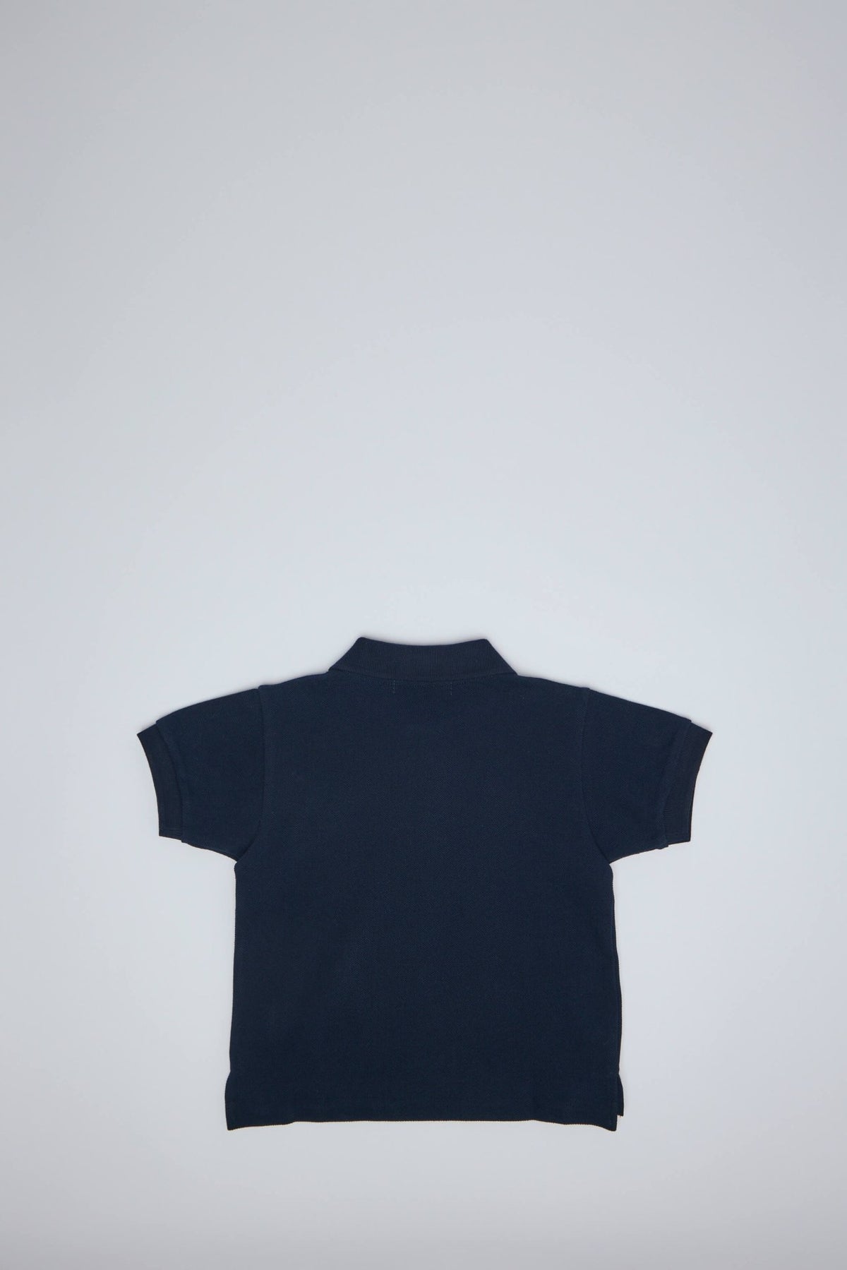 Kids wearing Comme des Garçons PLAY polo shirt styling