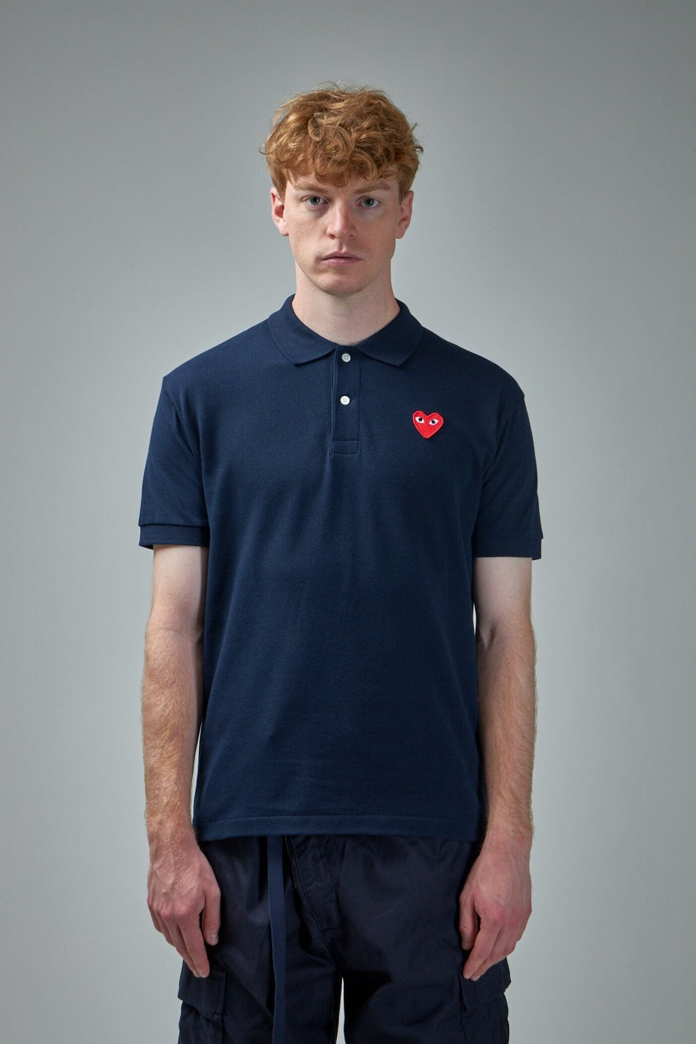 PLAY COMME DES GARÇONS NAVY POLO Play Comme des Garçons: Red Polo Shirt (Navy) | DSMNY E-SHOP