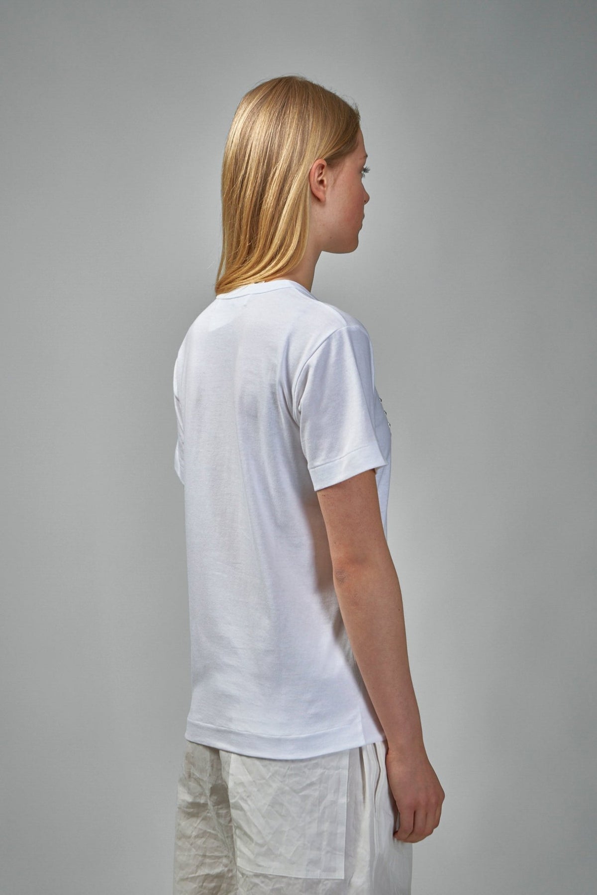 Back view of Comme des Garçons PLAY t-shirt showing clean design lines, view 7