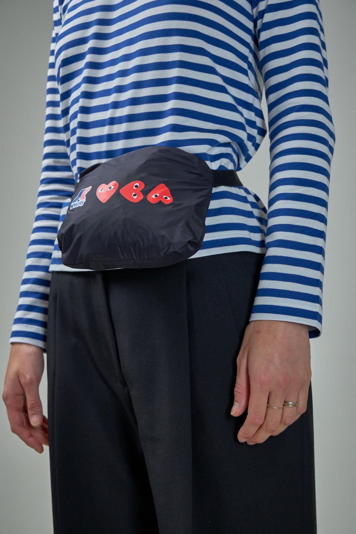 Comme des Garçons PLAY x K-Way raincoat fabric texture and construction detail