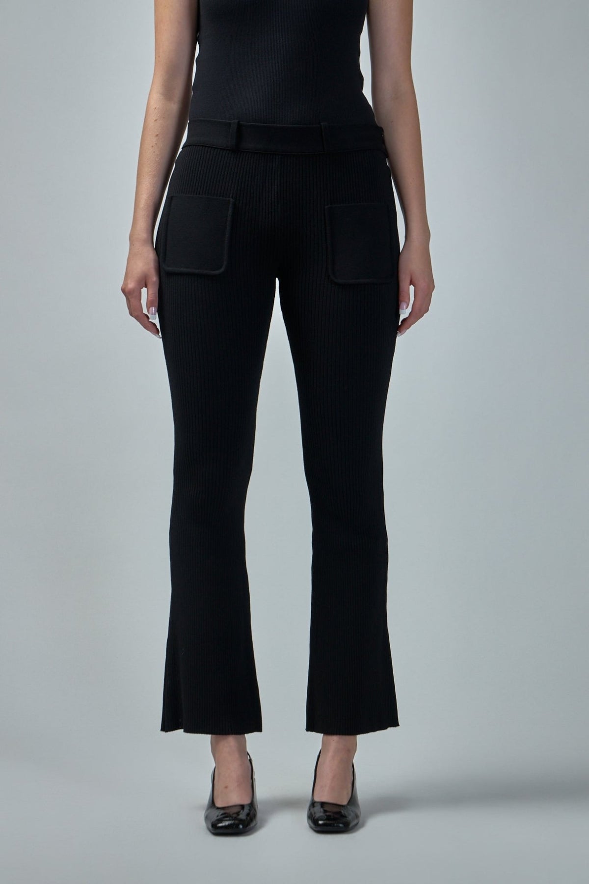 Side view showing subtle flared hem and cropped ankle length