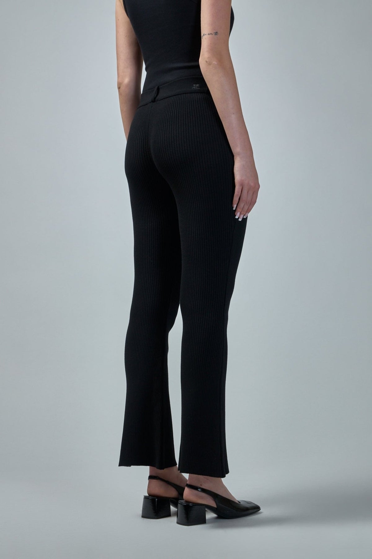 Back view highlighting high-waisted silhouette and belt loops
