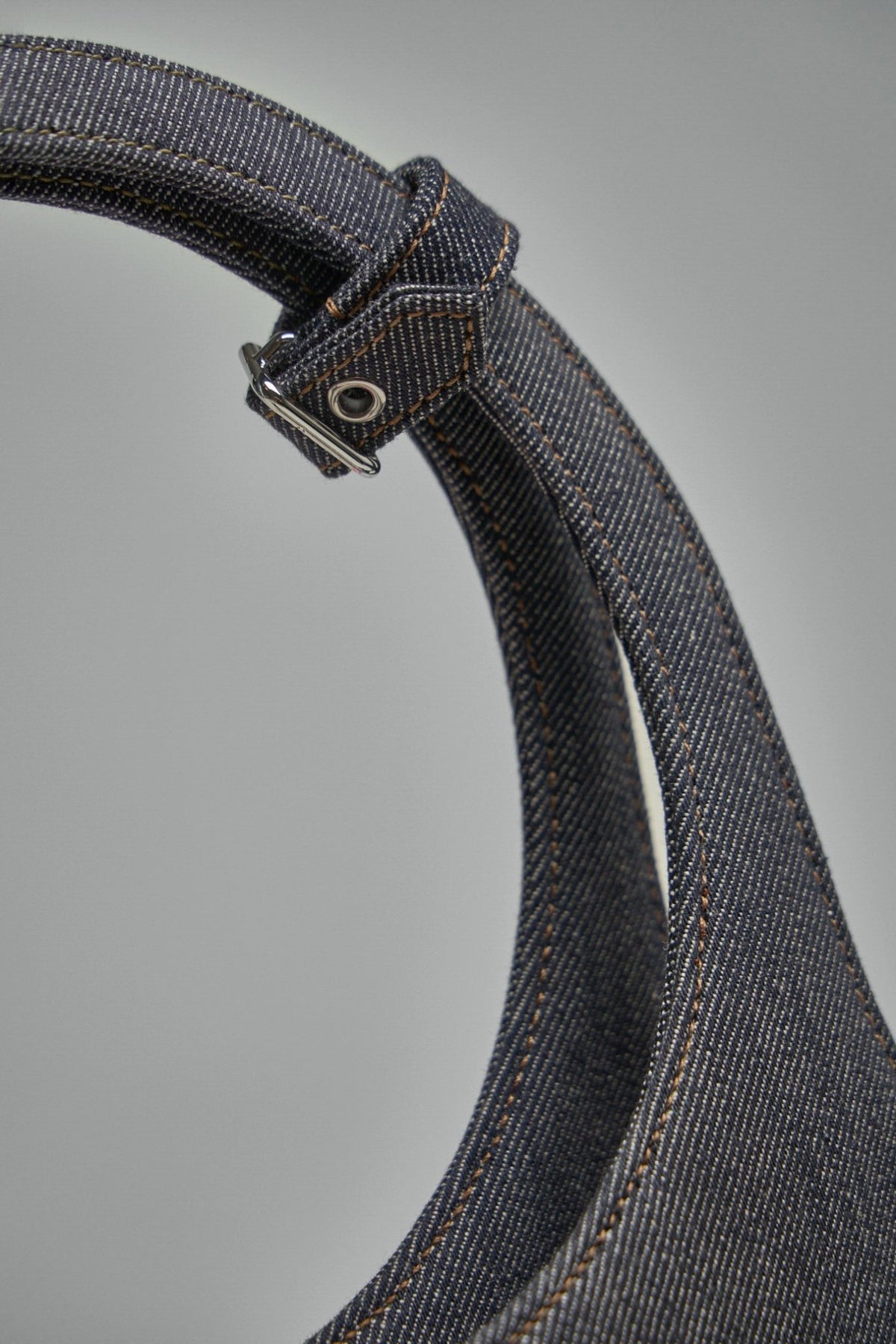 Interior view of Courrèges top handle bag showing organized pocket compartments