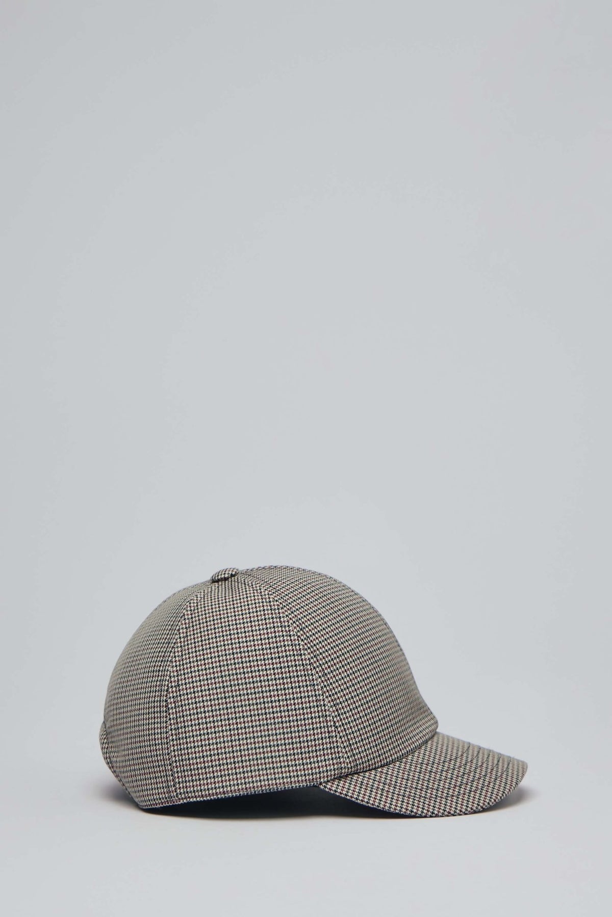 Side profile of Courrèges cap showing adjustable back closure and stitched panels
