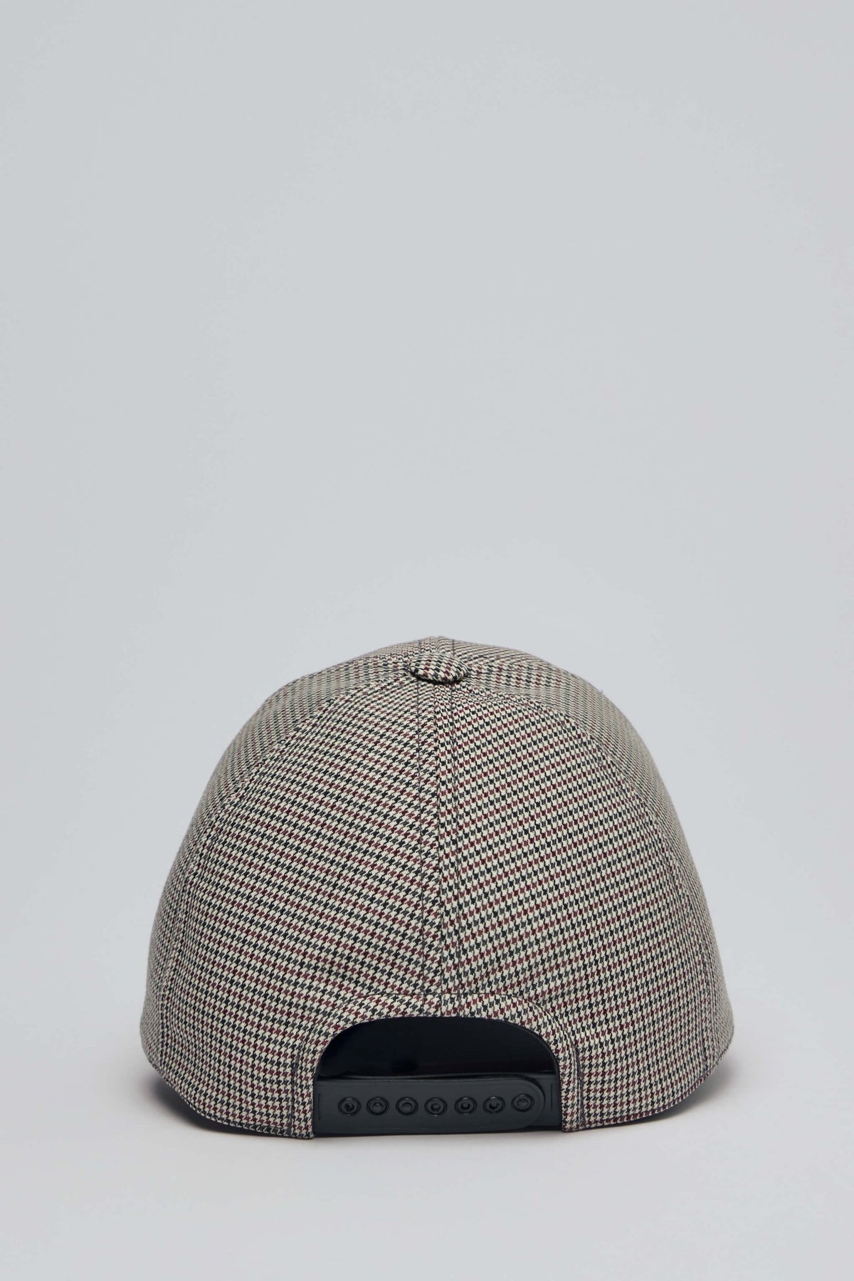 Courrèges cap worn styling shot demonstrating versatile fashion accessory