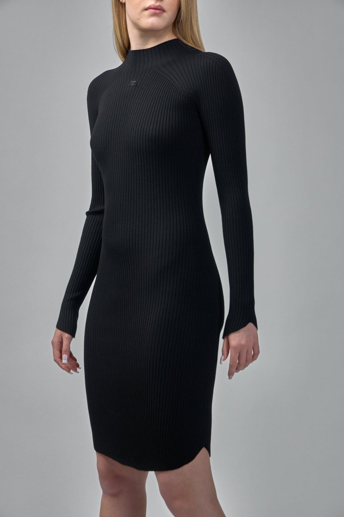 Side view highlighting the slim silhouette and raglan shoulder seams
