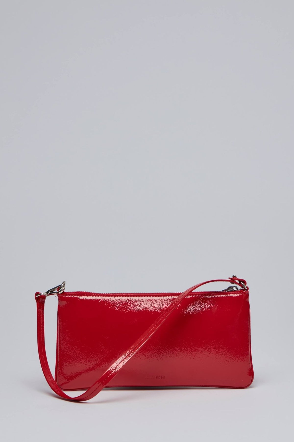 Courrèges red patent pouch worn as shoulder bag with strap